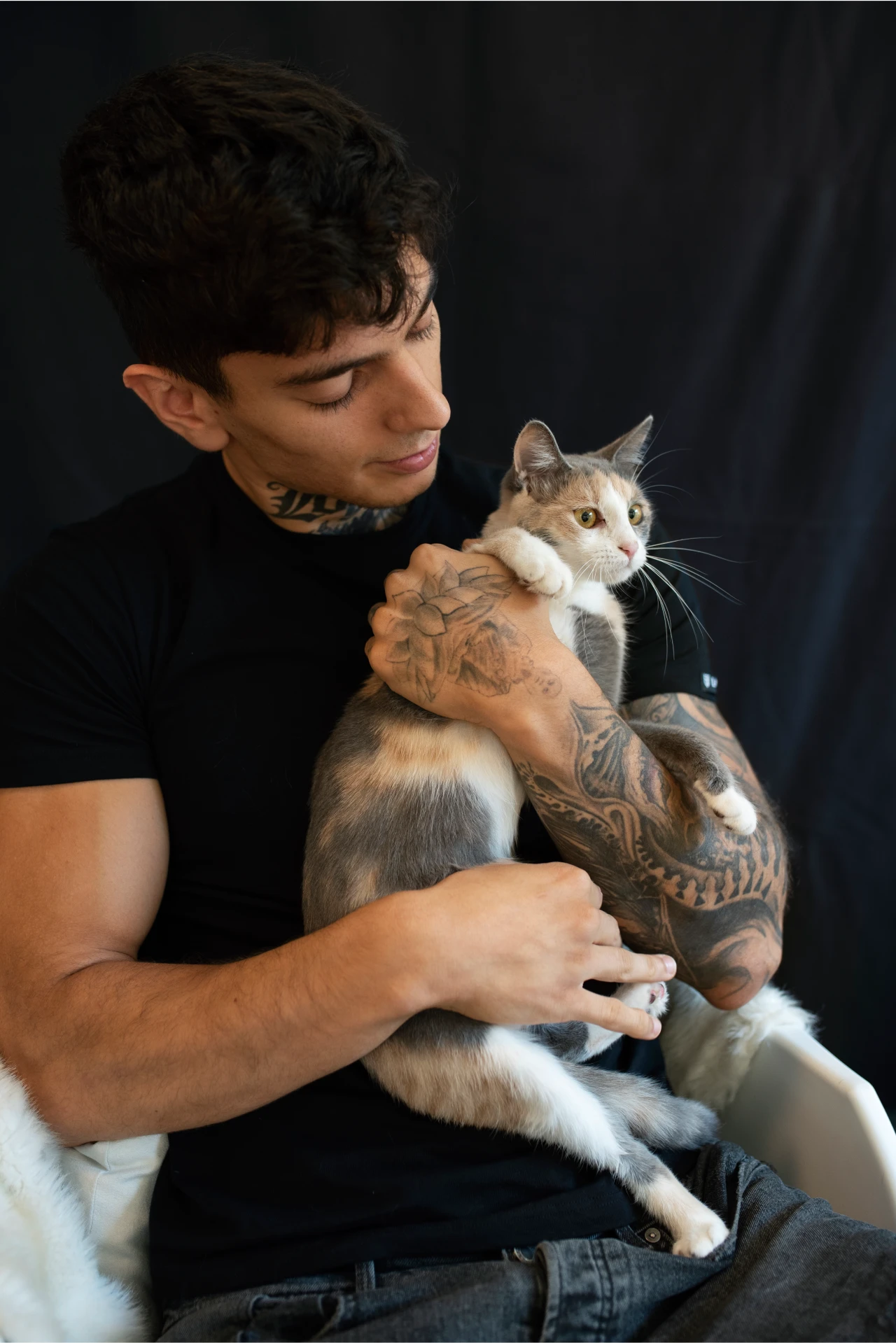 young-man-holding-cute-cat